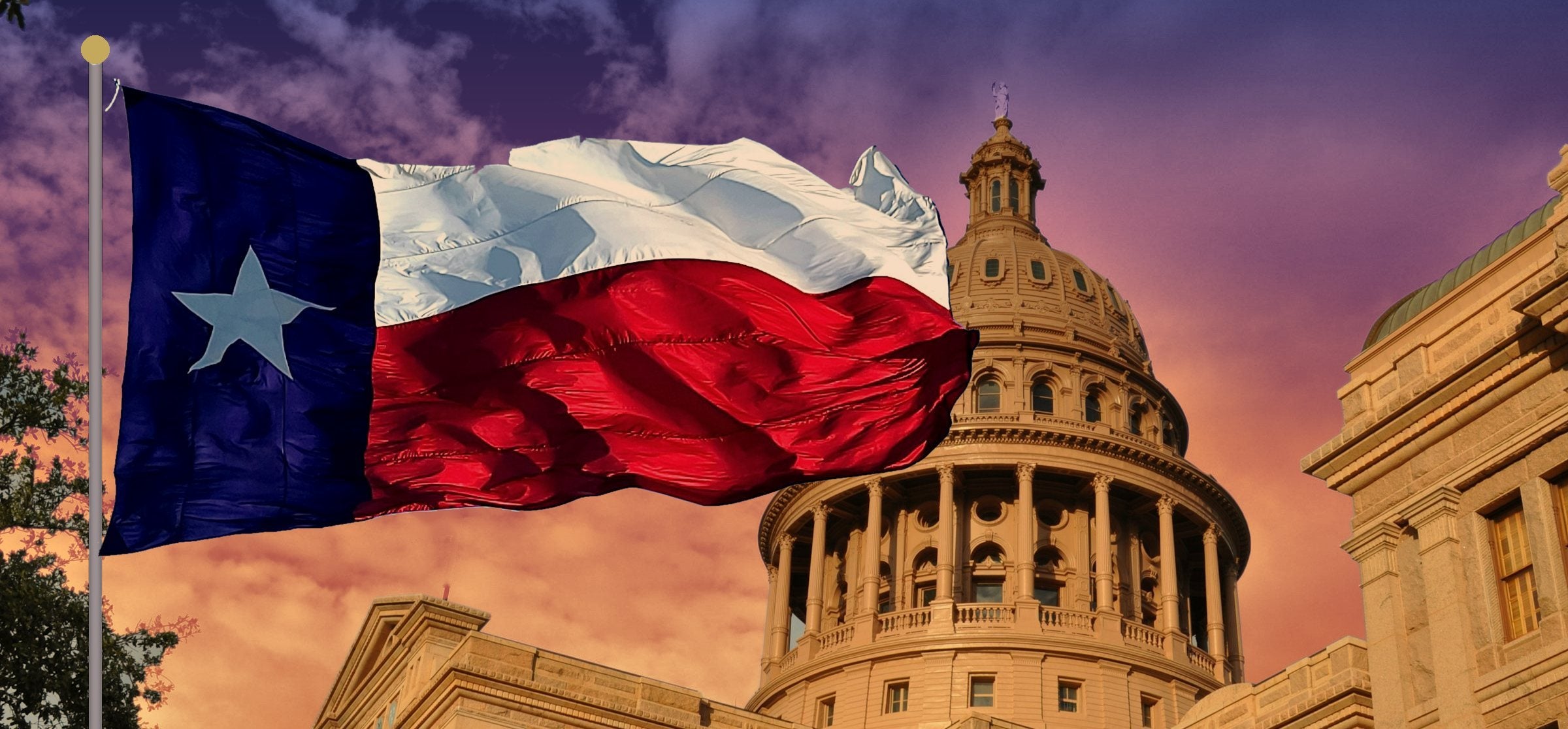 Texas flag waving beside the Texas State Capitol dome